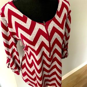 Large chevron shirt with zipper in the front.